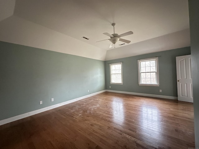 spare room with ceiling fan, lofted ceiling, and hardwood / wood-style flooring