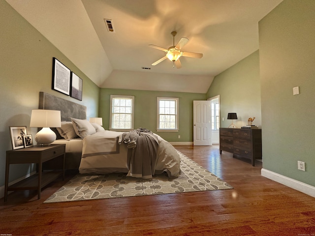 bedroom featuring dark hardwood / wood-style floors, ceiling fan, and lofted ceiling