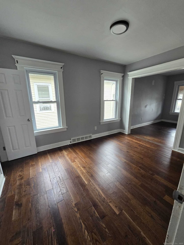 interior space with dark hardwood / wood-style floors