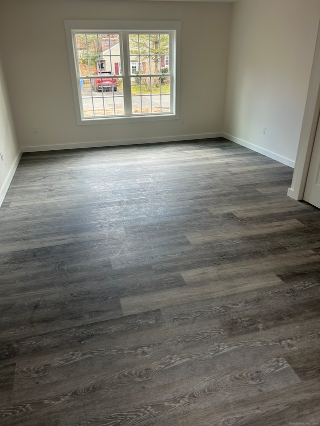 spare room featuring dark hardwood / wood-style floors