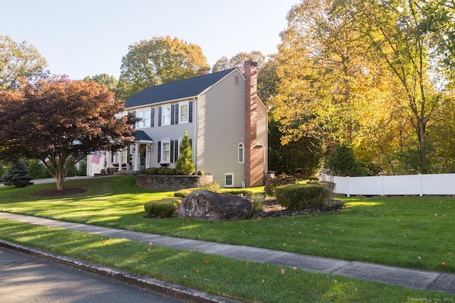 view of property exterior featuring a lawn