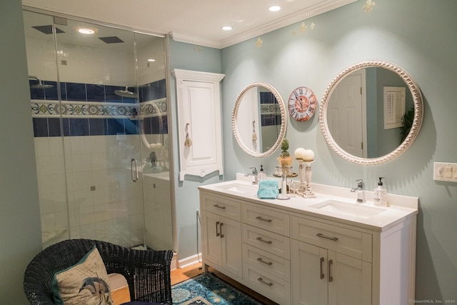 bathroom featuring vanity, walk in shower, and crown molding