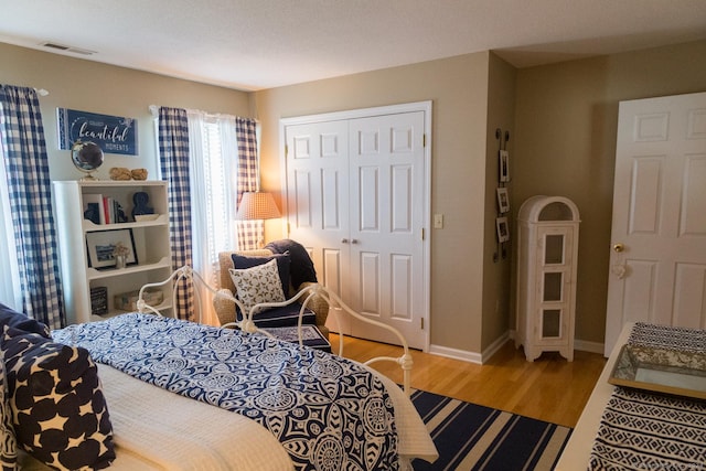 bedroom featuring a closet and wood-type flooring