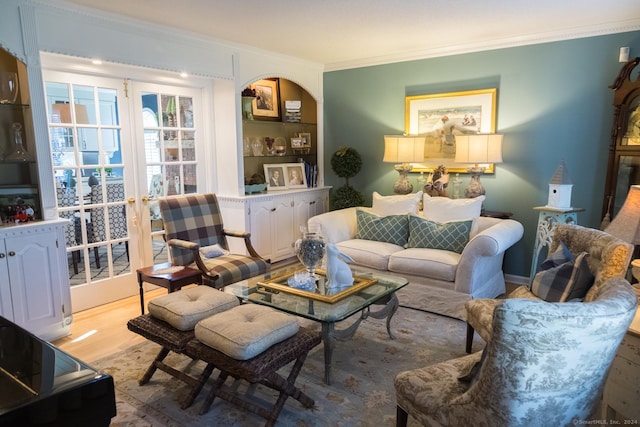 living room featuring light wood-type flooring and crown molding