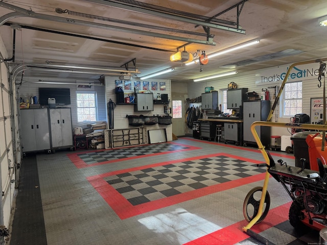 garage featuring a workshop area and a garage door opener