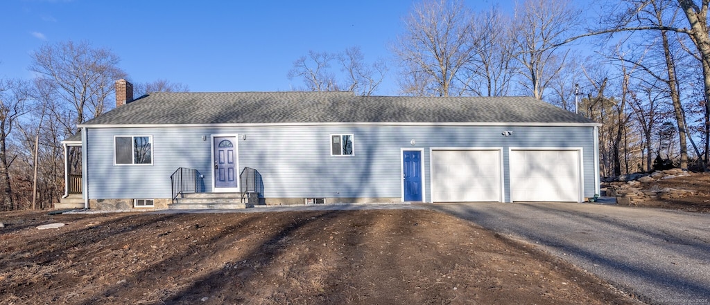 view of front of home featuring a garage