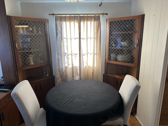 dining area with wood walls