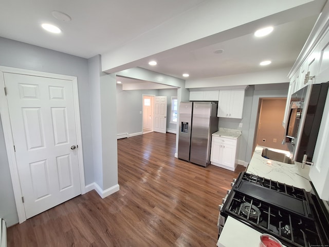 kitchen with white cabinetry, sink, dark wood-type flooring, light stone counters, and stainless steel refrigerator with ice dispenser