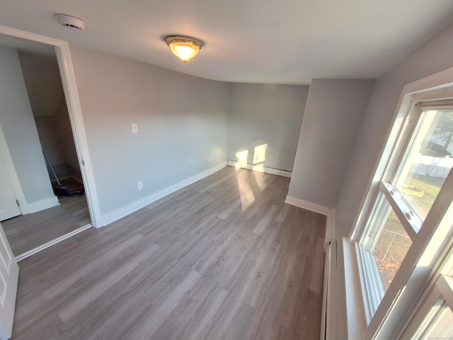 unfurnished room with light hardwood / wood-style floors