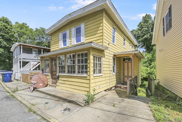 view of front of house featuring a sunroom