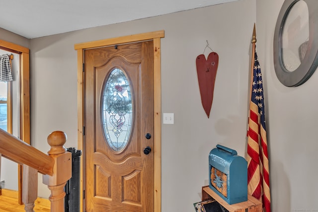 foyer entrance featuring wood-type flooring