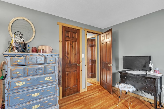 bedroom with light wood-type flooring