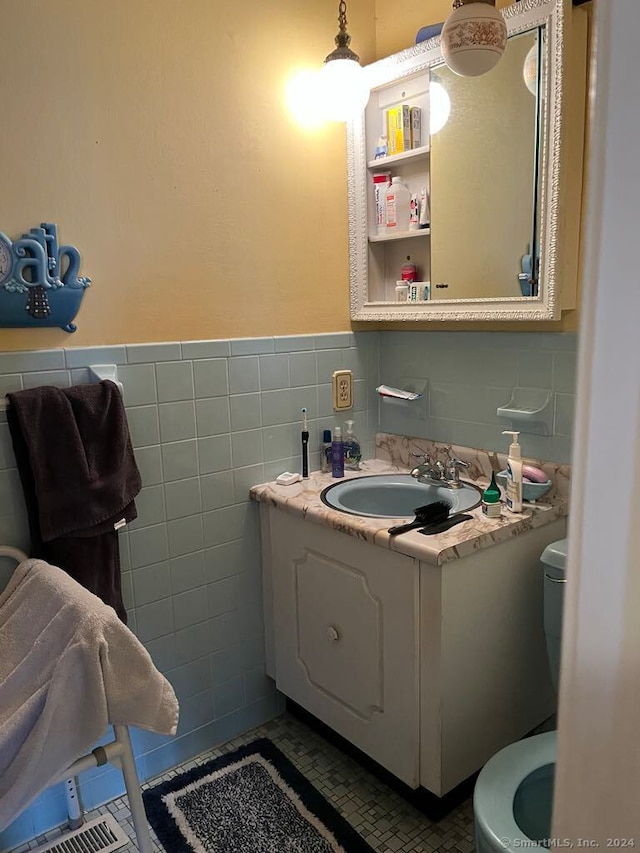 141 Carriage Path S Unit 141, Milford, CT 06460 - half bath with tile walls, vanity, and wainscoting