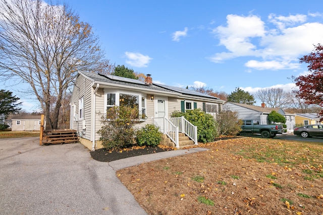 view of front of home with solar panels