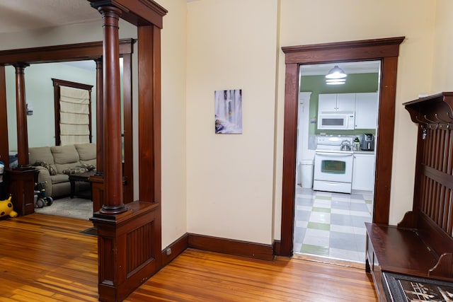 corridor featuring hardwood / wood-style floors