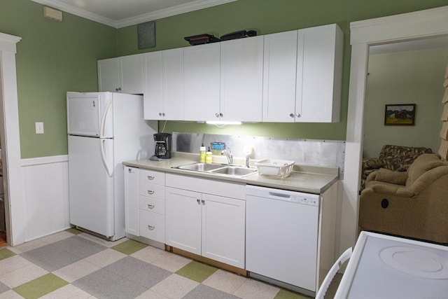 kitchen with white cabinetry, sink, white appliances, and crown molding