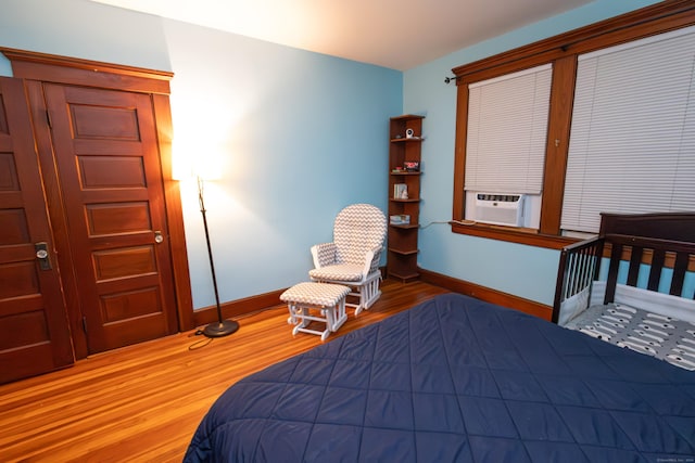 bedroom featuring cooling unit and hardwood / wood-style floors