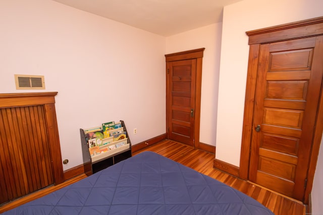 unfurnished bedroom featuring dark wood-type flooring