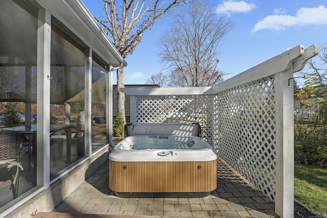 view of patio / terrace with a hot tub