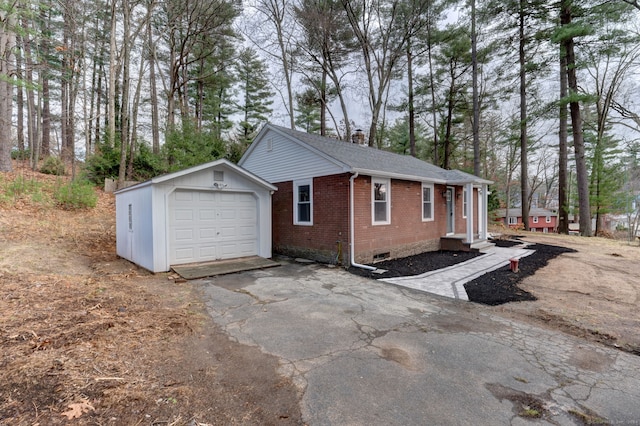 view of side of home with an outbuilding and a garage