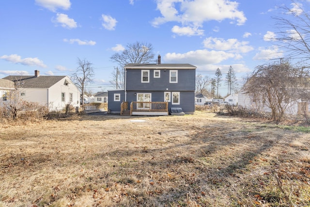 back of property with a wooden deck