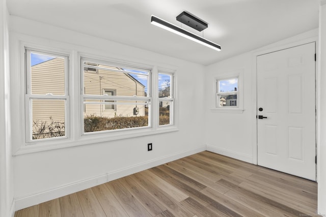 unfurnished room featuring light hardwood / wood-style flooring