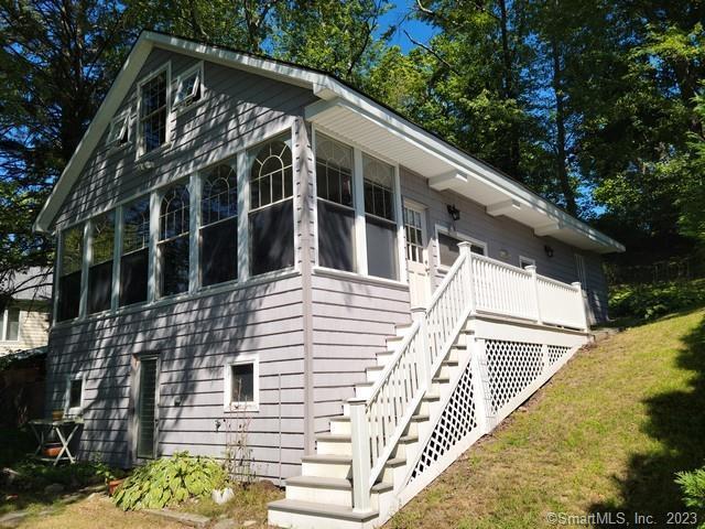 view of side of property with a sunroom