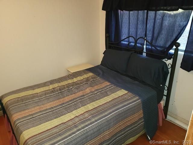 bedroom featuring dark wood-type flooring