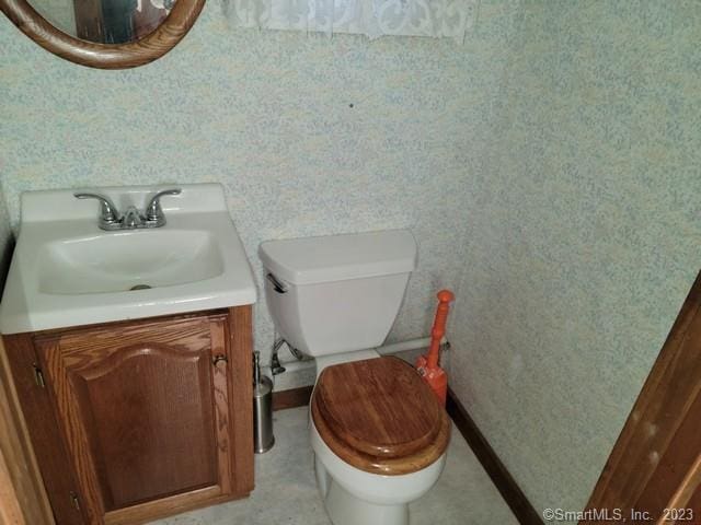 bathroom with vanity and toilet