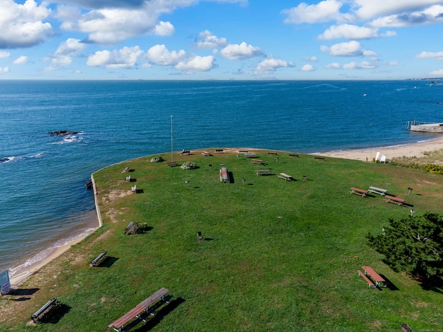 bird's eye view with a water view and a beach view