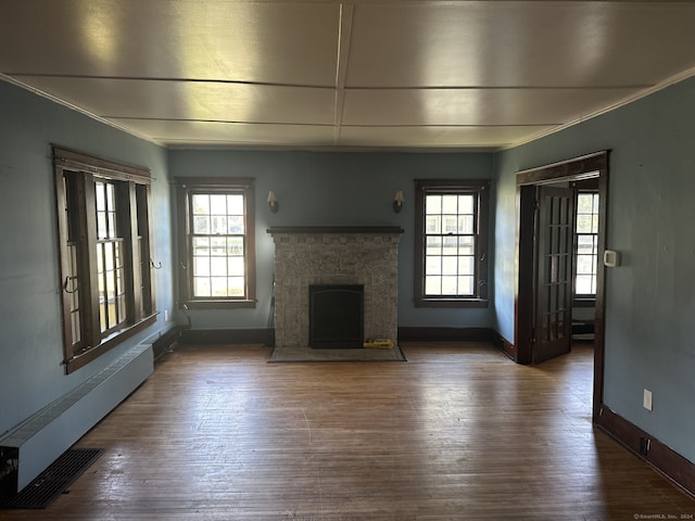 146 Johnson St, Naugatuck, CT 06770 - unfurnished living room featuring ornamental molding, a fireplace with flush hearth, and wood finished floors