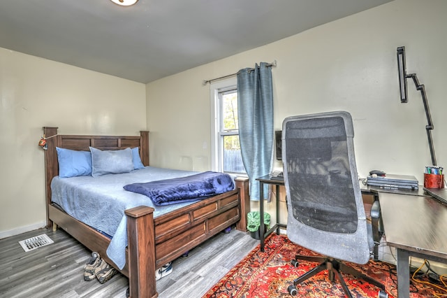 bedroom with light hardwood / wood-style floors