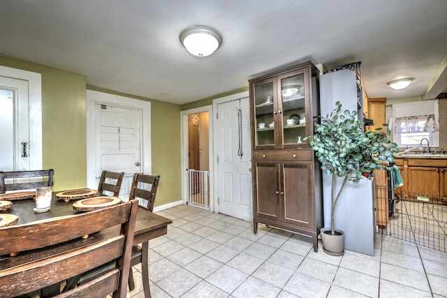 kitchen featuring sink and light tile patterned floors