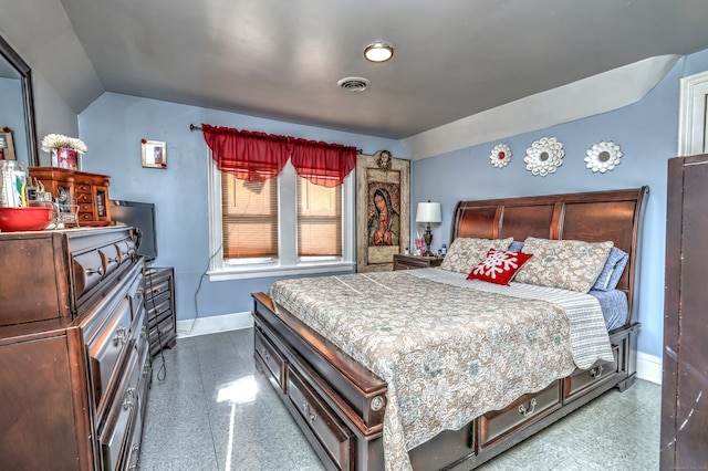 bedroom with vaulted ceiling