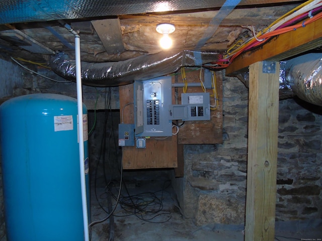 unfinished basement featuring electric panel