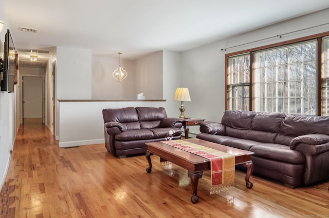 living room with light hardwood / wood-style floors