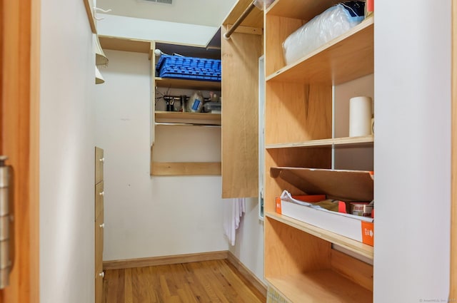 spacious closet featuring light wood-type flooring