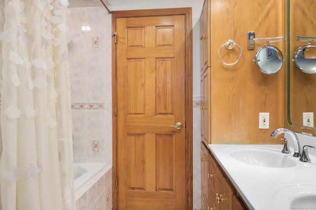 bathroom with shower / tub combo and vanity