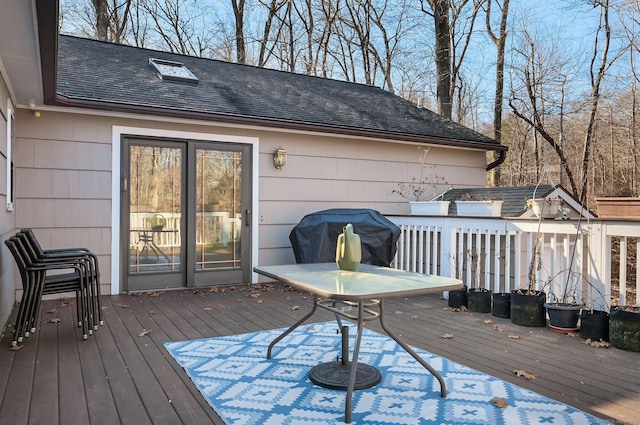 wooden deck with area for grilling