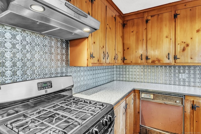 kitchen featuring stainless steel gas range oven, black dishwasher, range hood, and tasteful backsplash