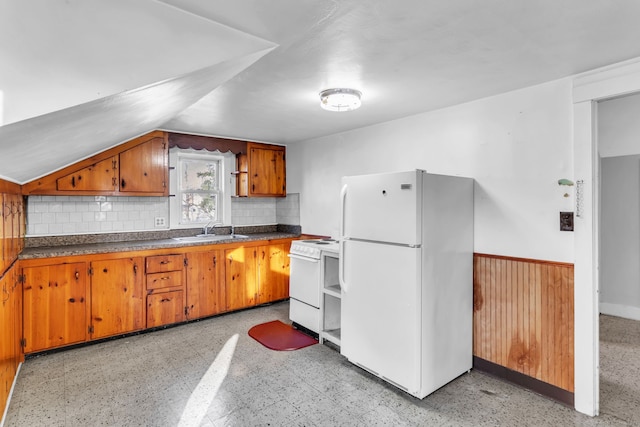 kitchen featuring white appliances, sink, and tasteful backsplash