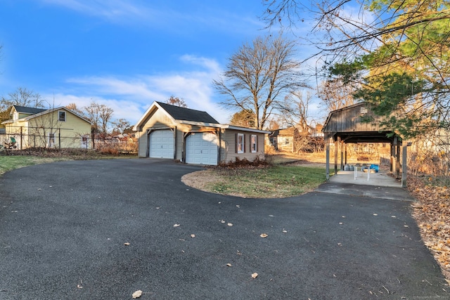 view of side of property with a garage