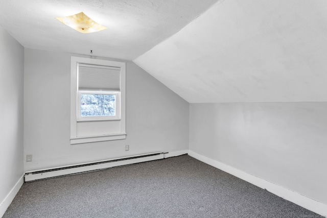 bonus room featuring a textured ceiling, carpet floors, a baseboard radiator, and lofted ceiling