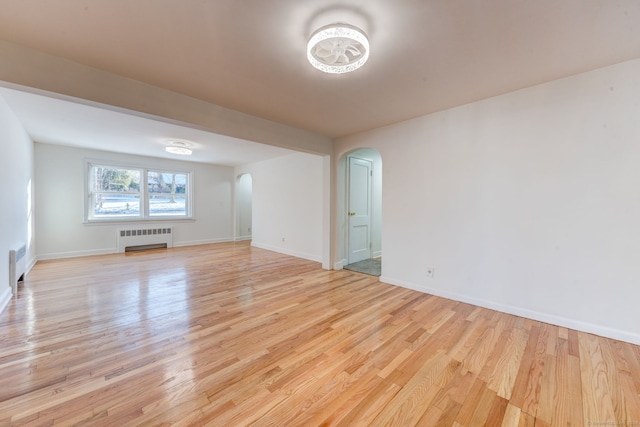 interior space featuring light wood-type flooring and radiator