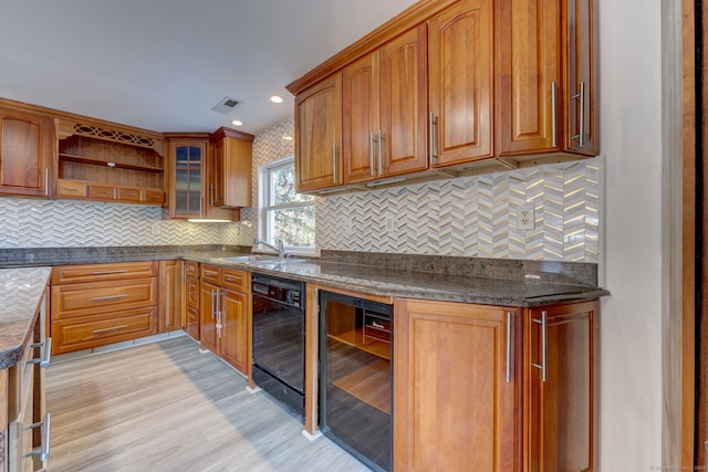 kitchen with dishwasher, dark stone counters, light hardwood / wood-style flooring, decorative backsplash, and beverage cooler