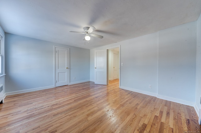 spare room with ceiling fan and light hardwood / wood-style flooring