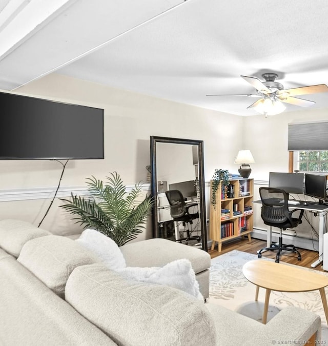 office with hardwood / wood-style floors and ceiling fan