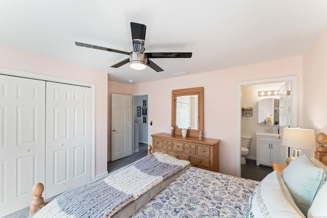 bedroom featuring sink, connected bathroom, a closet, and ceiling fan