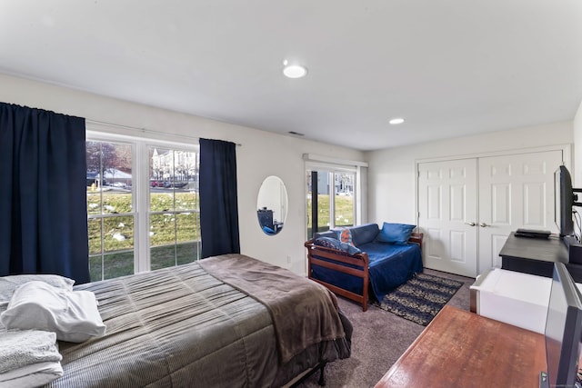 bedroom with carpet floors and a closet