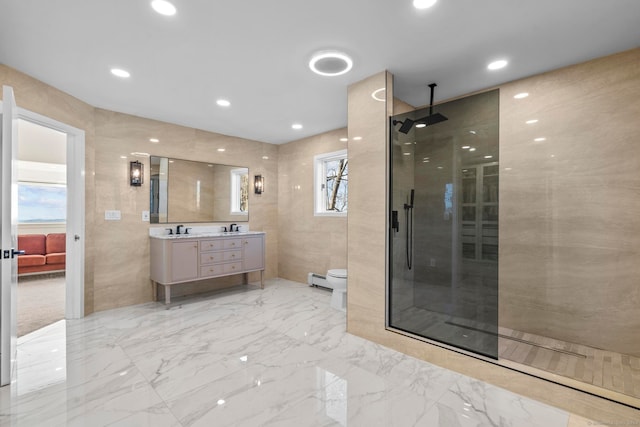 bathroom featuring a shower, toilet, and tile walls